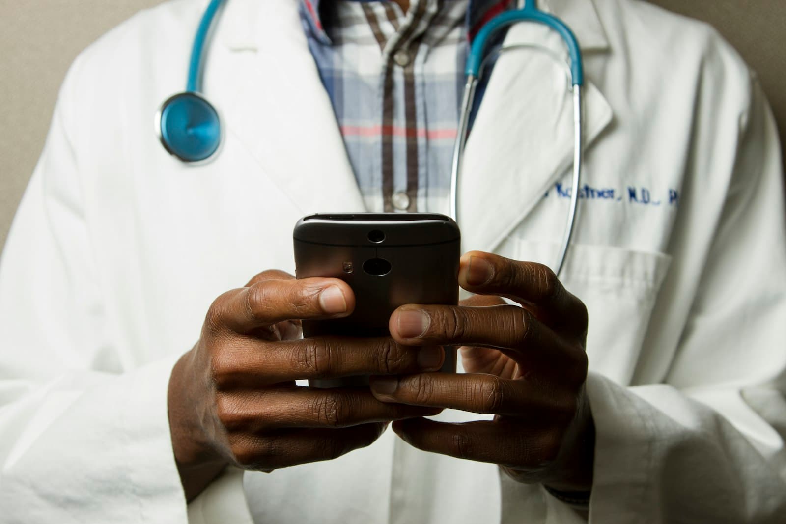 Healthcare professional reviewing clinical documentation on a laptop